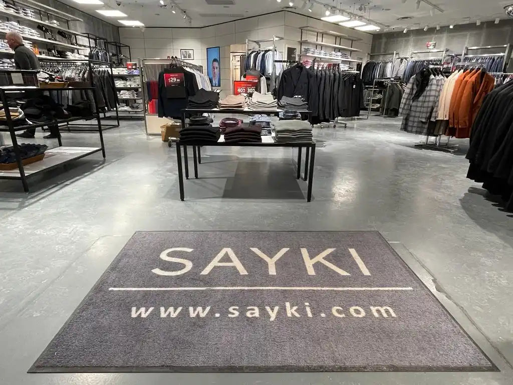 Floor mat with ’SAYKI www.sayki.com’ text displayed on it.